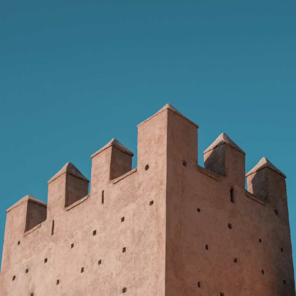 brown concrete building under blue sky during daytime