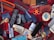 A variety of disparate objects are arranged on a red fabric surface, including multiple old mobile phones, a television remote control, a fidget spinner, a razor in an orange case, and several leather wallets. Other items include a shoe brush, writing pens, a small MP3 player, and a bar of soap. The collection features miscellaneous everyday items and novelties.
