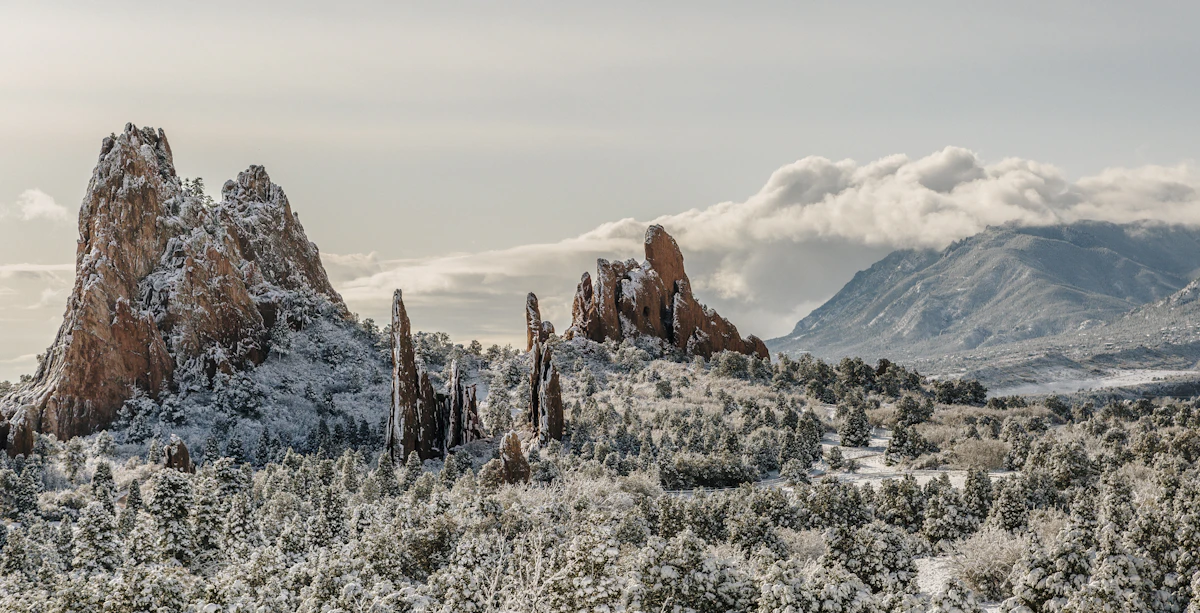Sandstone rock formations against a pale sky, typical of the terrain around Colorado Springs