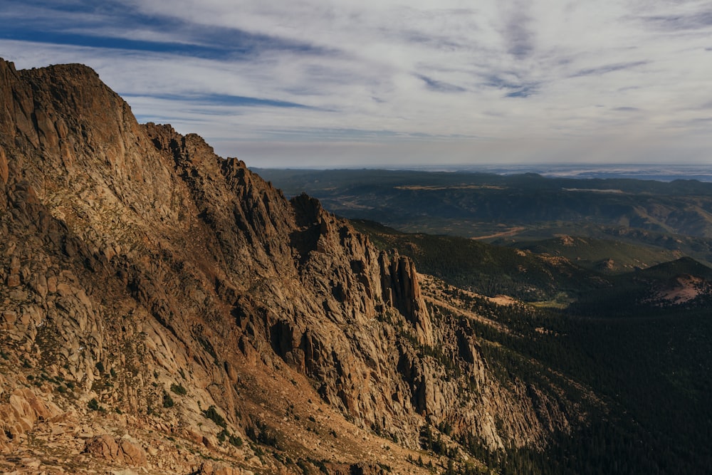 brown rocky mountain under blue sky during daytime