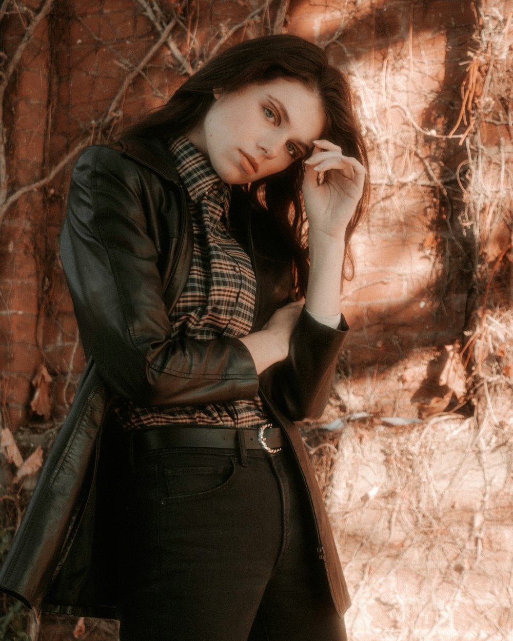 woman in black leather jacket and black skirt