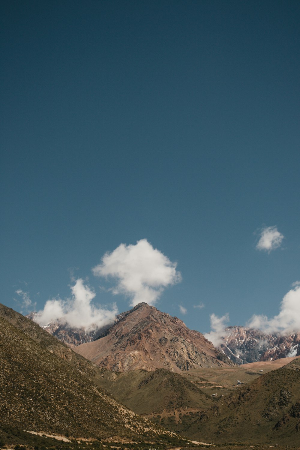 brown mountain under blue sky during daytime