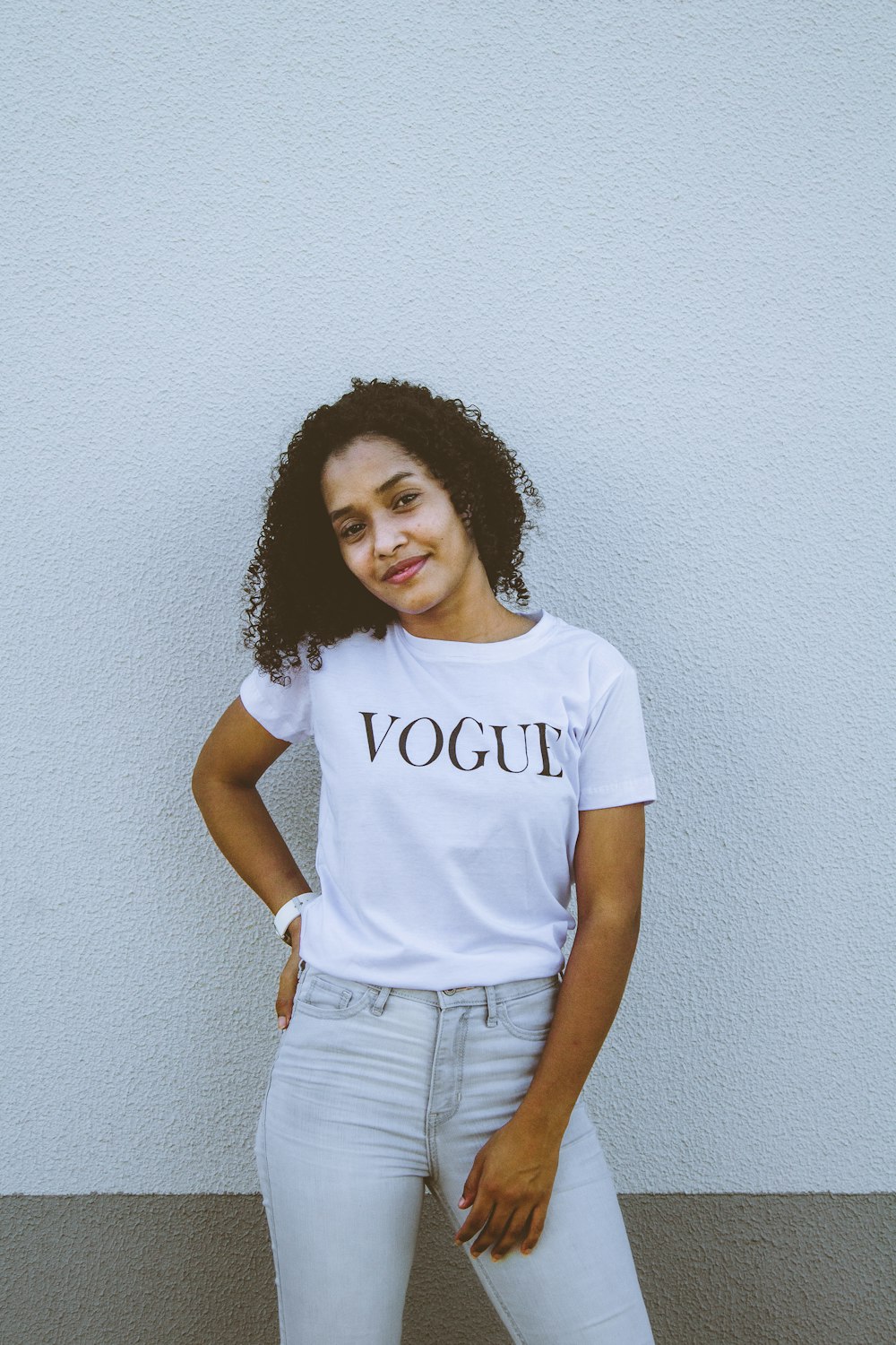 woman in white crew neck t-shirt and blue denim shorts