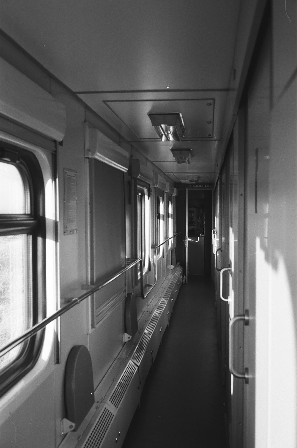 grayscale photo of train interior