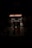 An entrance to a Japanese restaurant is seen with a glowing neon sign reading 'JAPANESE RESTAURANT.' Beneath, a green sign displays 'Sushi Yan' and the address '770 Thurlow St.' The image is dimly lit, creating a moody atmosphere.