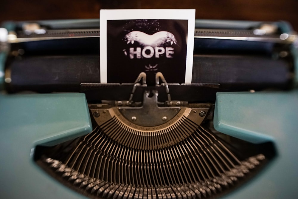 black and gray typewriter on black table