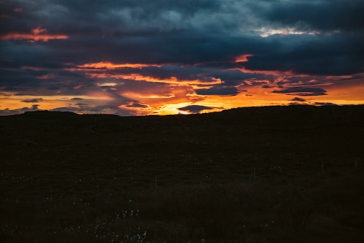 A dramatic sunset over a world map with highlighted geopolitical hotspots.