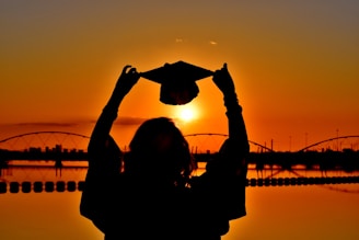 woman in black long sleeve shirt holding heart shaped paper