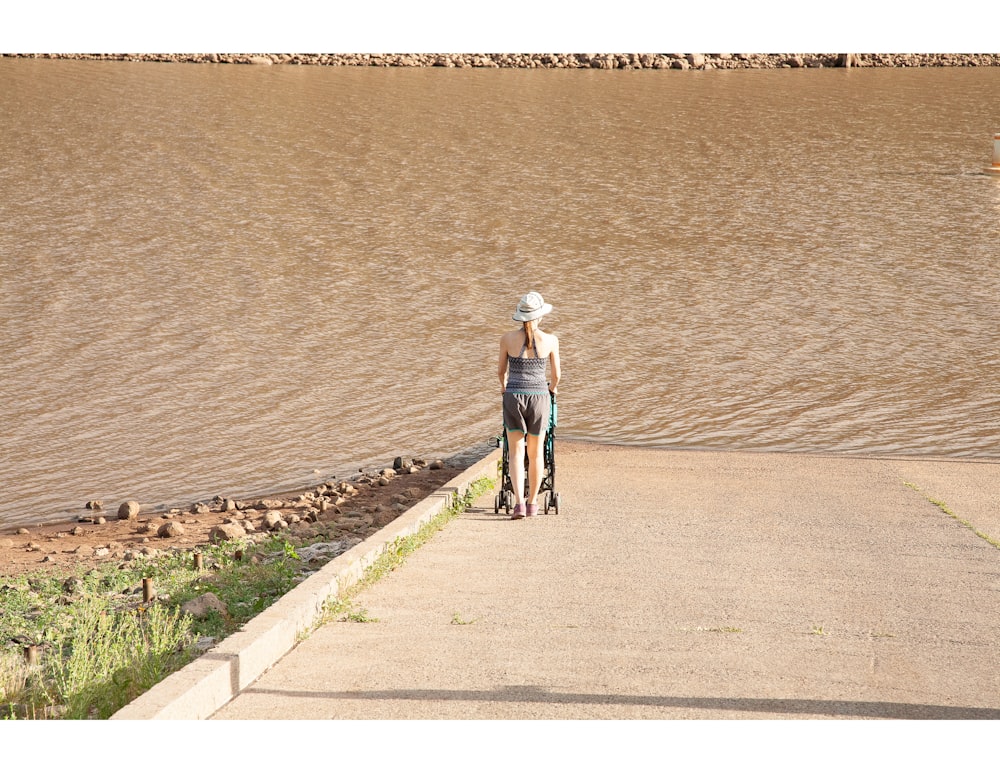 man and woman walking on the beach during daytime