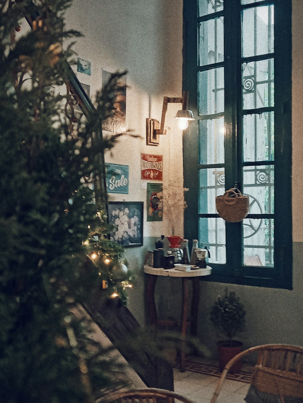 green christmas tree near brown wooden table