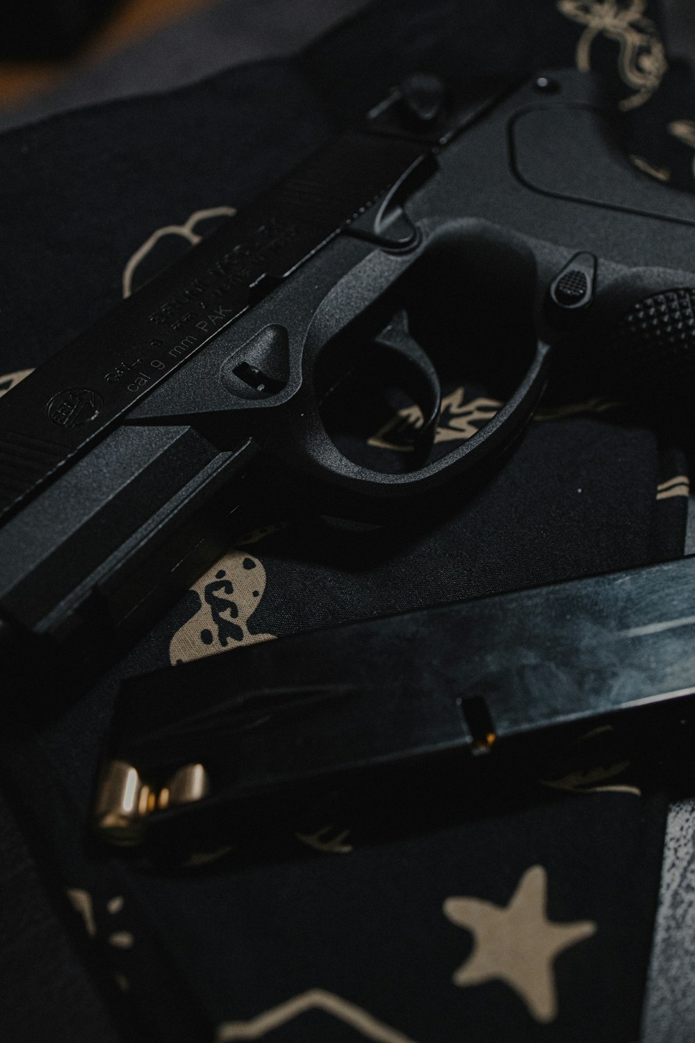 black semi automatic pistol on black case