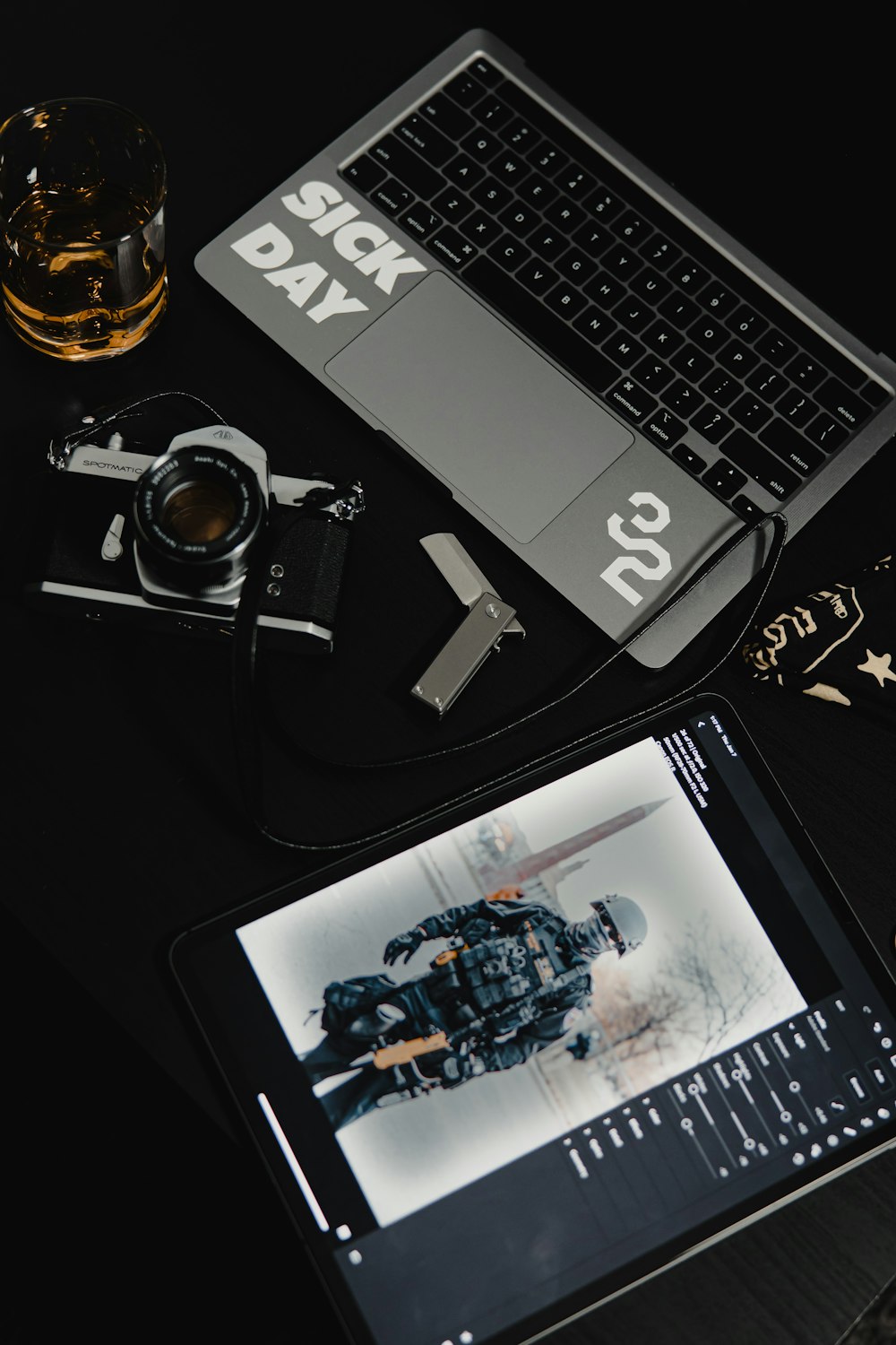 black and silver dslr camera beside black and silver laptop computer