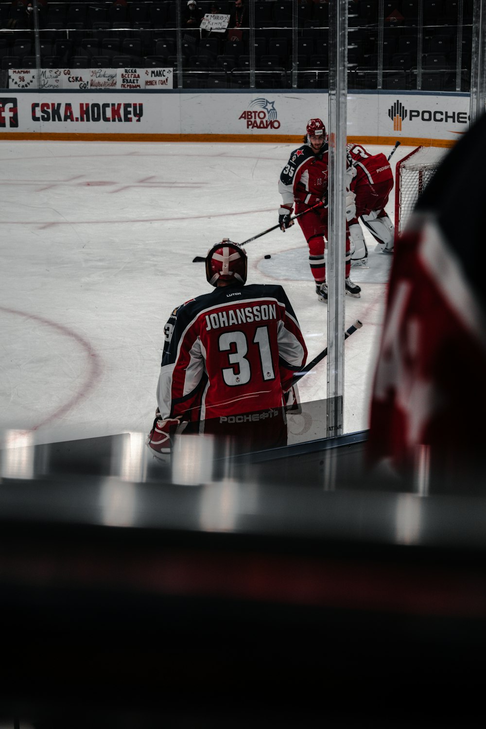 2 men playing ice hockey