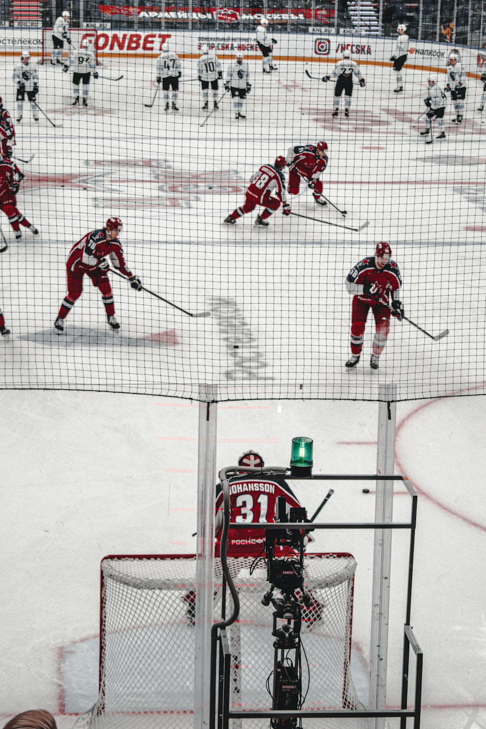 2 men playing ice hockey