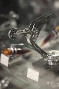silver and black trophy on table