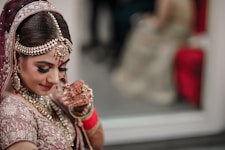 woman in red and gold sari