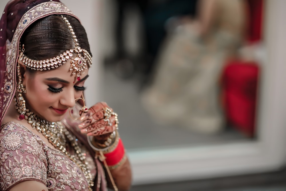 woman in red and gold sari