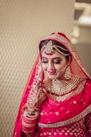woman in red and gold hijab