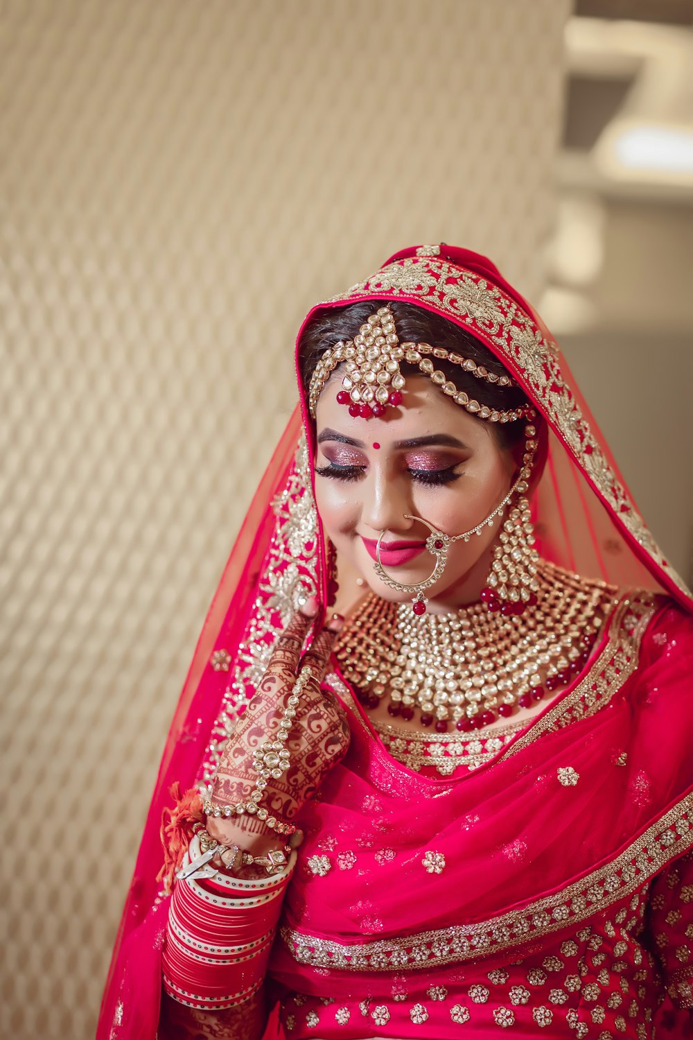 woman in red and gold hijab