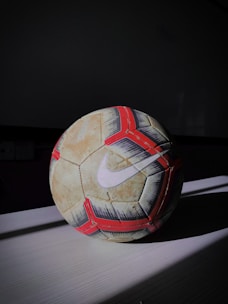 white and red soccer ball