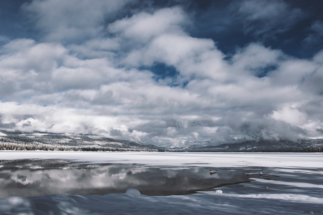 white clouds over snow covered field during daytime