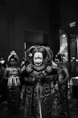 grayscale photo of person wearing mask