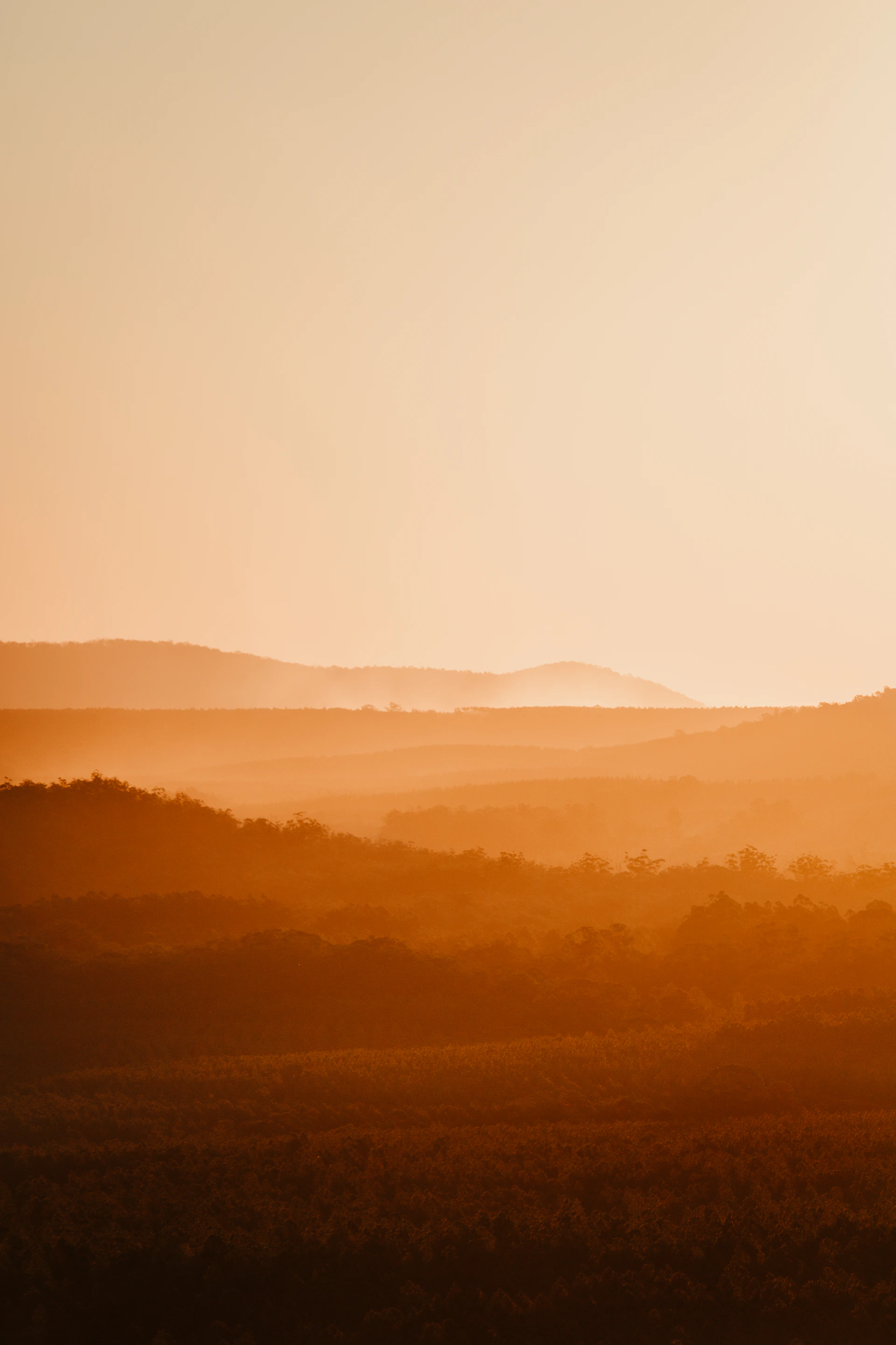 silhouette of mountains during sunset