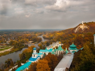 A panoramic view of an Orthodox monastery courtyard during golden hour.