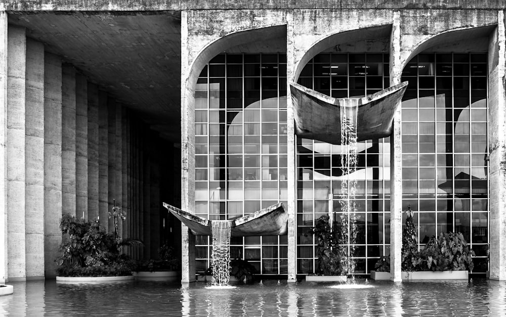 grayscale photo of water fountain