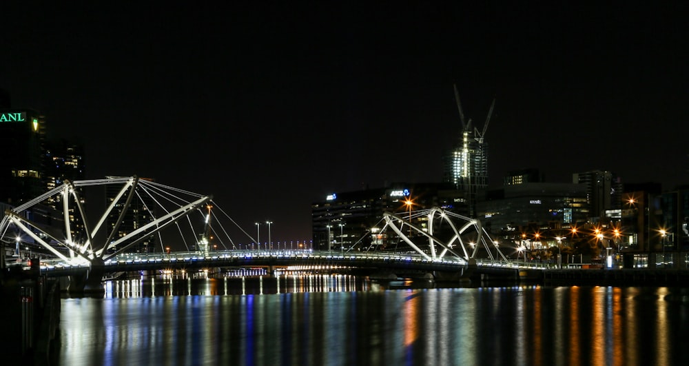 bridge over water during night time