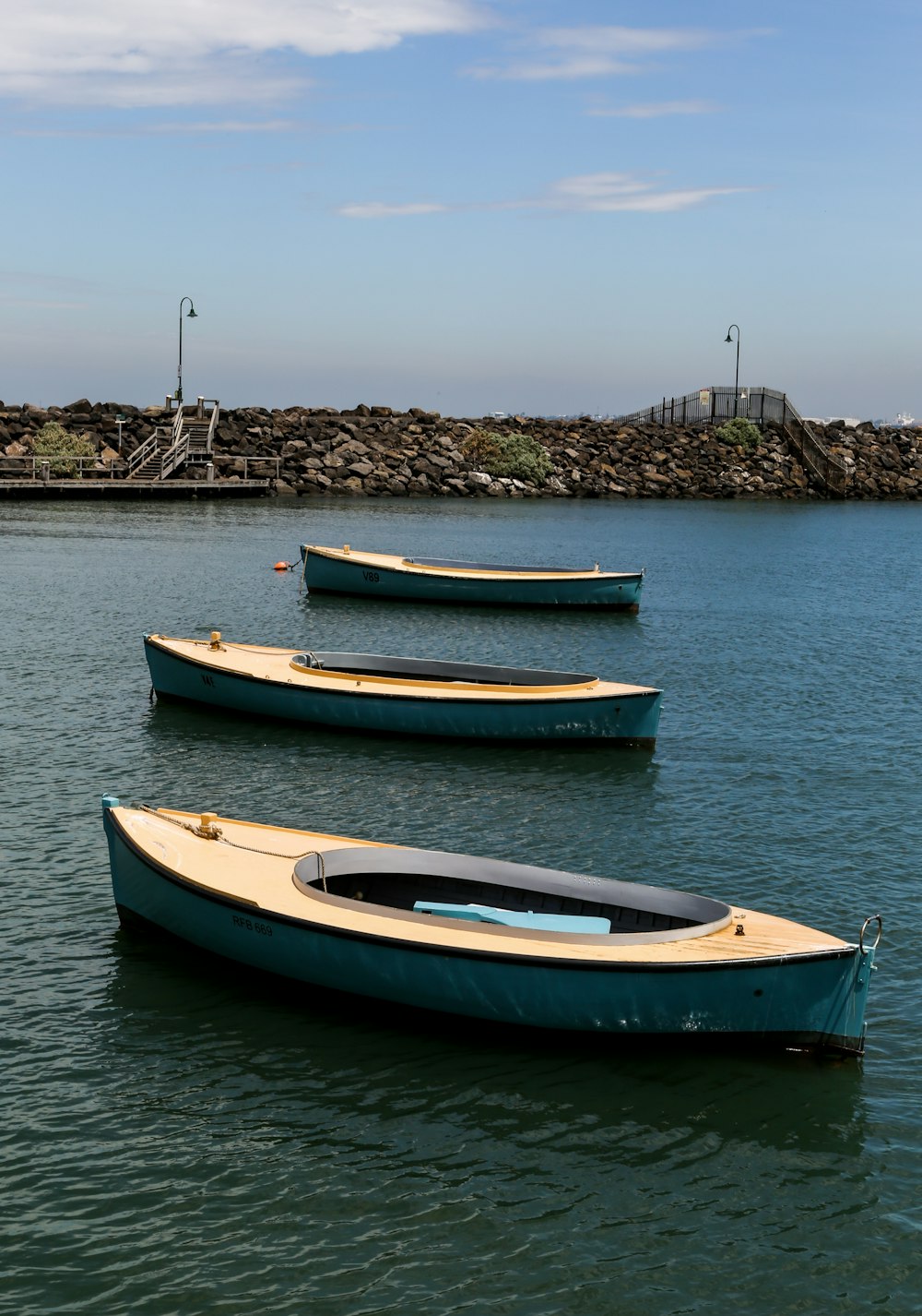 white and blue boat on sea during daytime