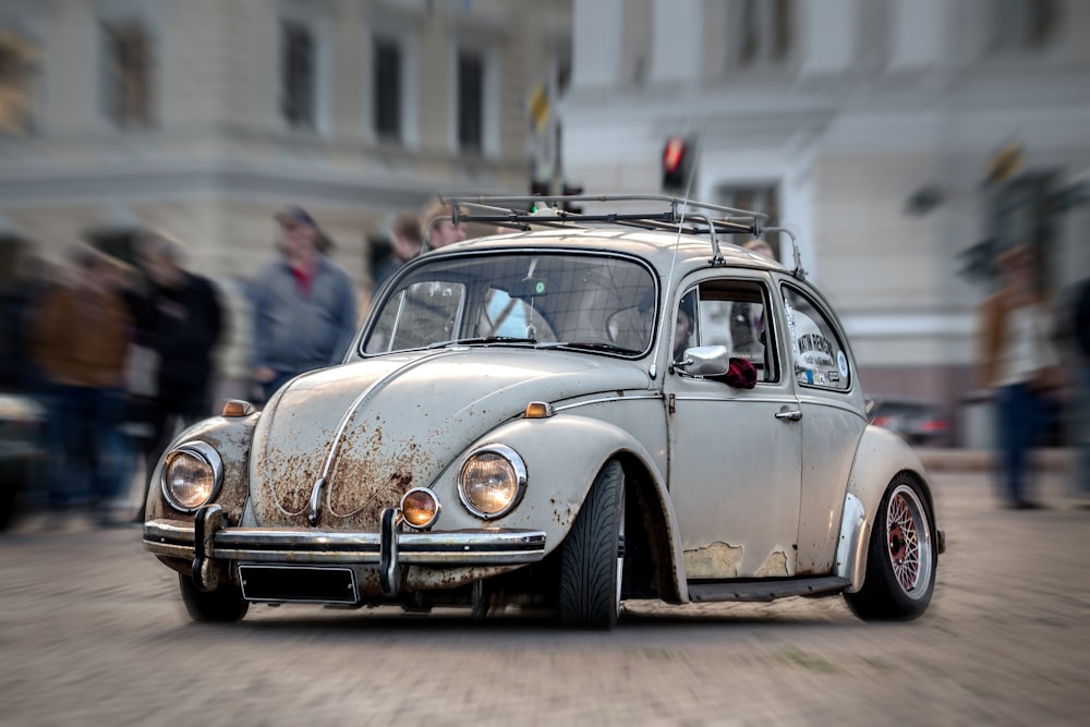 brown volkswagen beetle parked on street during daytime
