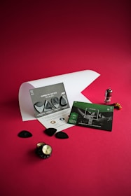 green and white card on red table