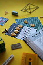Close-up of vibrant 3D mental health art pieces displayed alongside Simon’s music equipment.