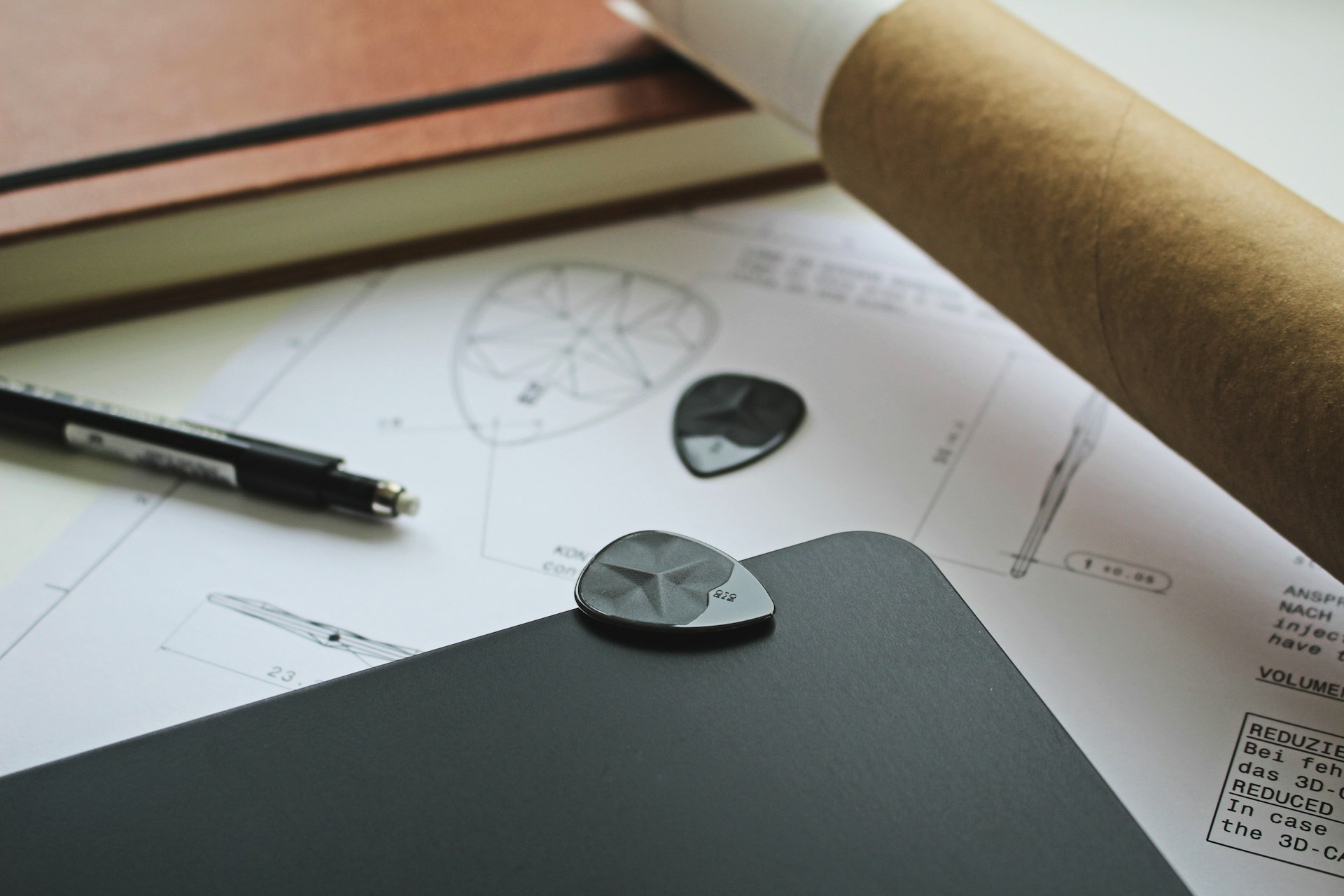 black and silver round coin on black surface