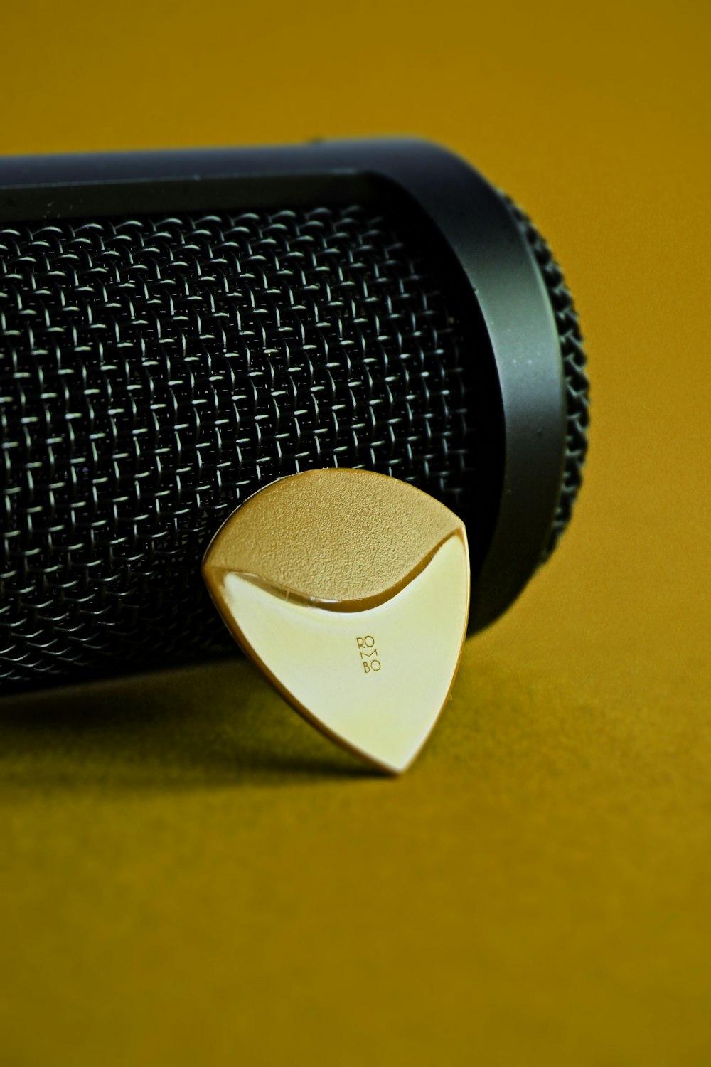 black and white speaker on yellow textile