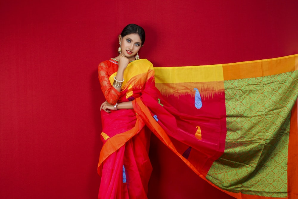 woman in yellow and red sari dress