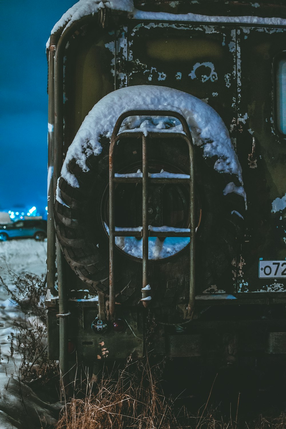 black volkswagen car covered with snow