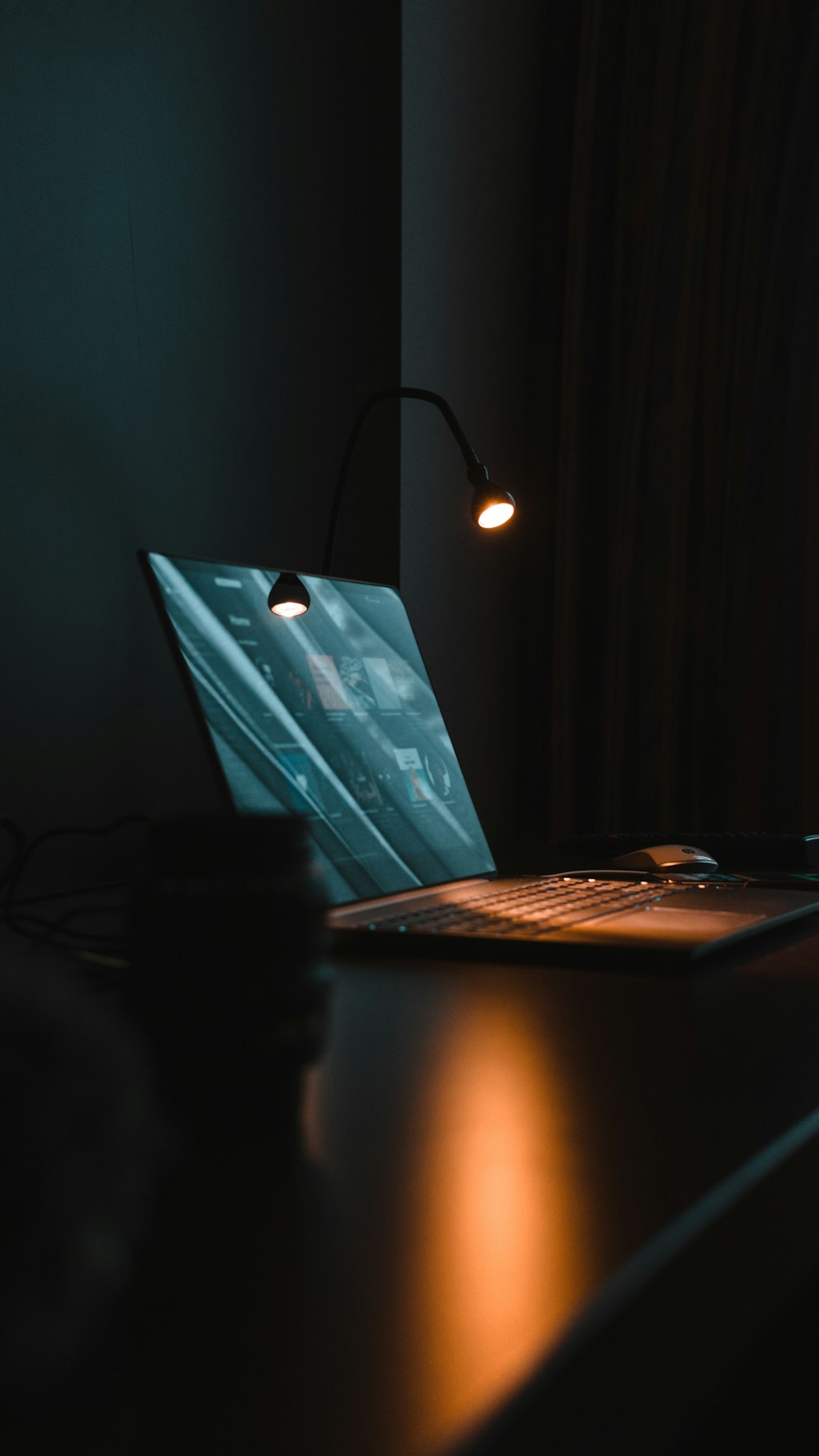 silver macbook on brown wooden table