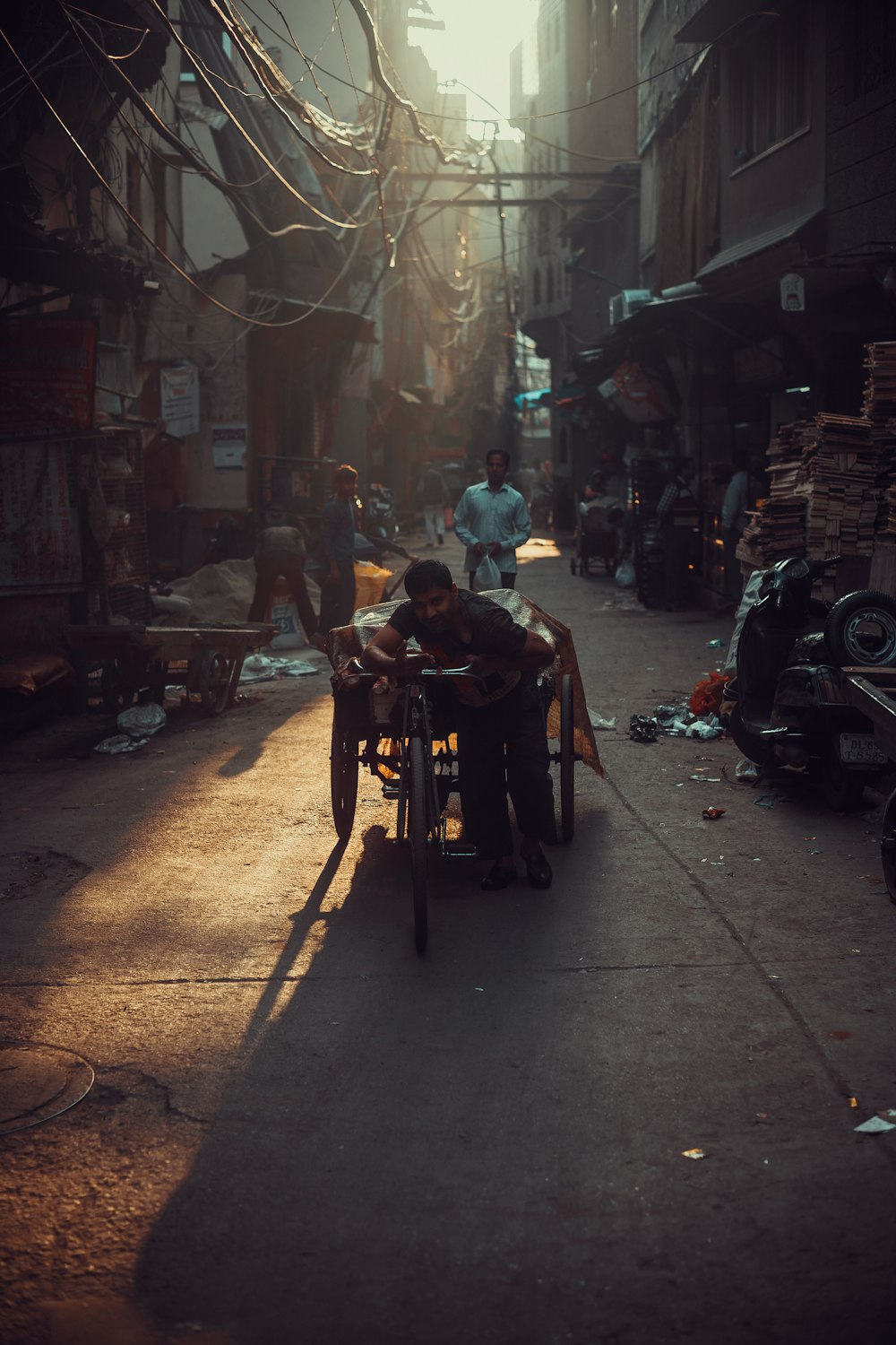 people sitting on chairs near motorcycle during nighttime