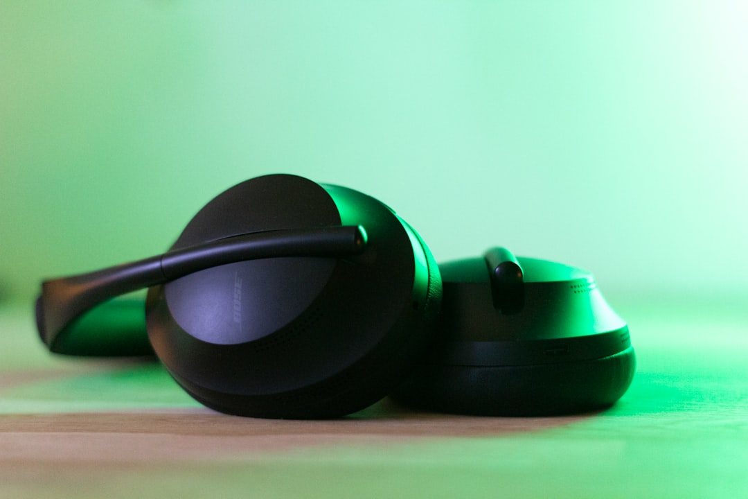 black and green headphones on green surface, Bose headphones lying at my desk