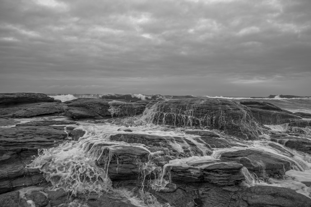 grayscale photo of water falls