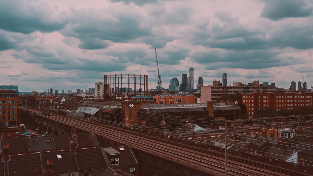 city buildings under white clouds during daytime