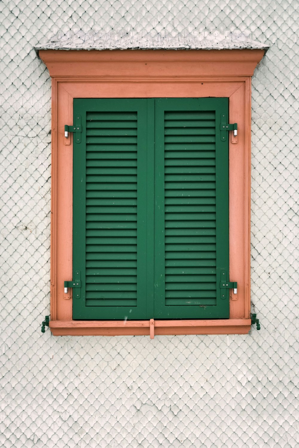 brown wooden door on white wall