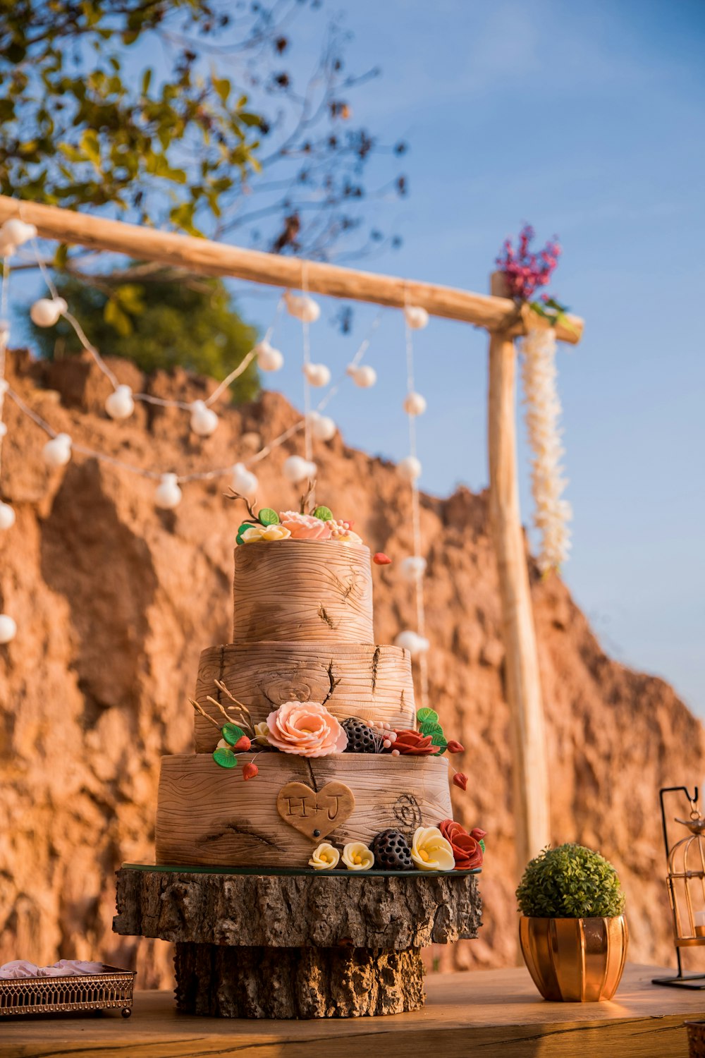 brown wooden hanging pot on brown concrete wall during daytime