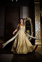 A stunning debutante dress presented in a luxurious golden ambiance.