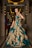 A woman stands elegantly in a luxurious hallway, wearing a long teal gown with intricate gold embroidery. The setting features ornate lighting and mirrors, adding a sophisticated ambiance.