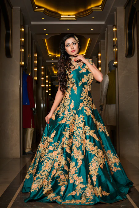 A sophisticated woman in an opulent dark-hued Italian ladies suit with gold accents, standing in a classic Italian villa setting.