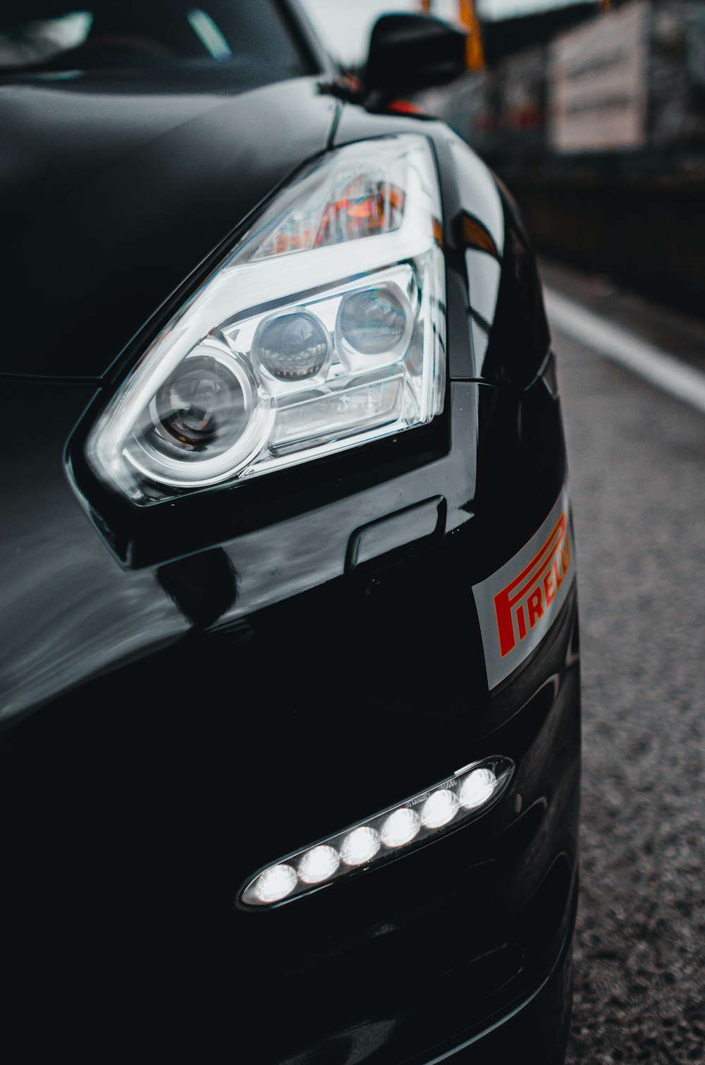 black car on gray asphalt road