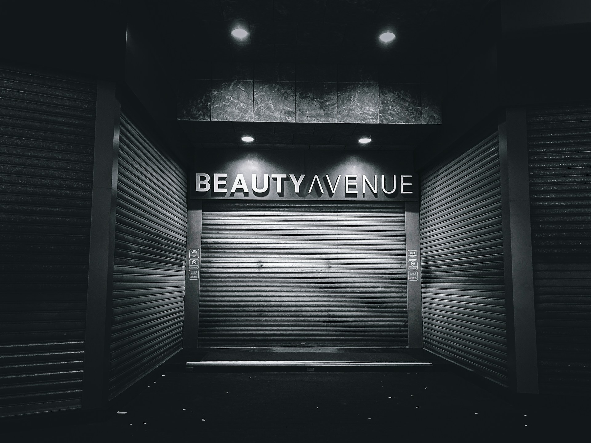 a black and white photo of a closed storage unit